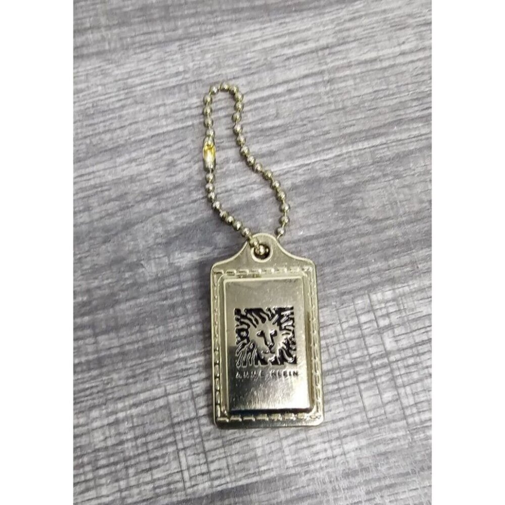 Anne Klein Tag Gold Tone Lion approx 2.25” x 1.25”